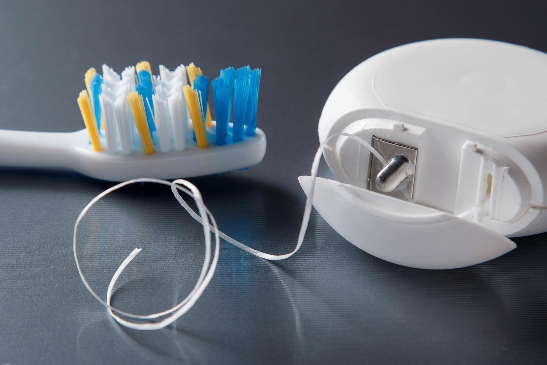 close up of floss and toothbrush | preventive dental care apple valley