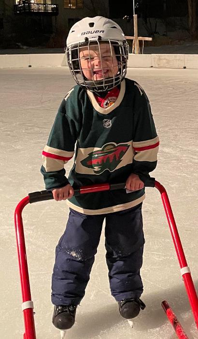 boy playing hockey smiling l emergency children's dentistry apple valley mn