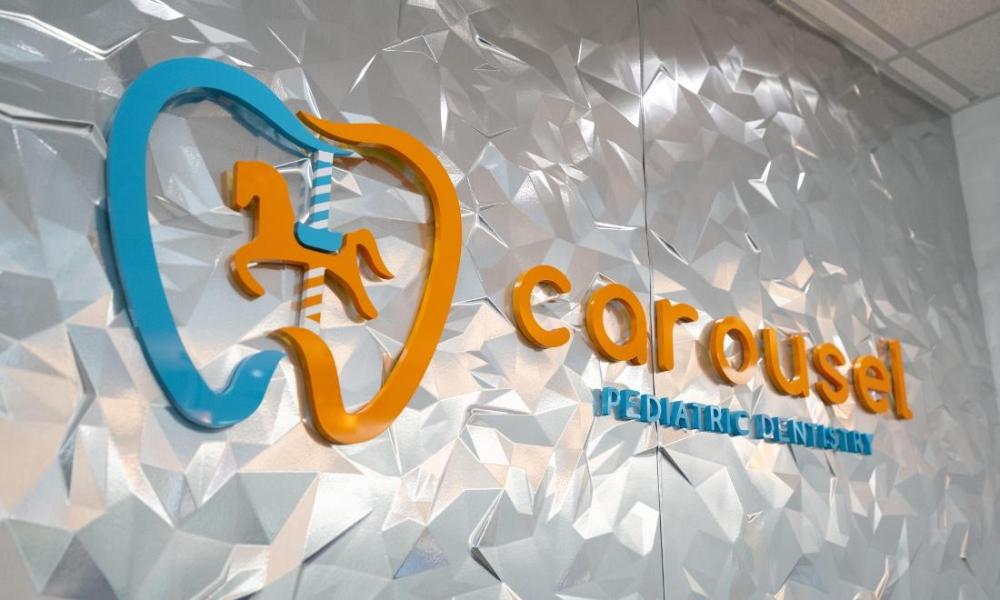 carousel pediatric dentistry & orthodontics logo | pediatric dentist near me