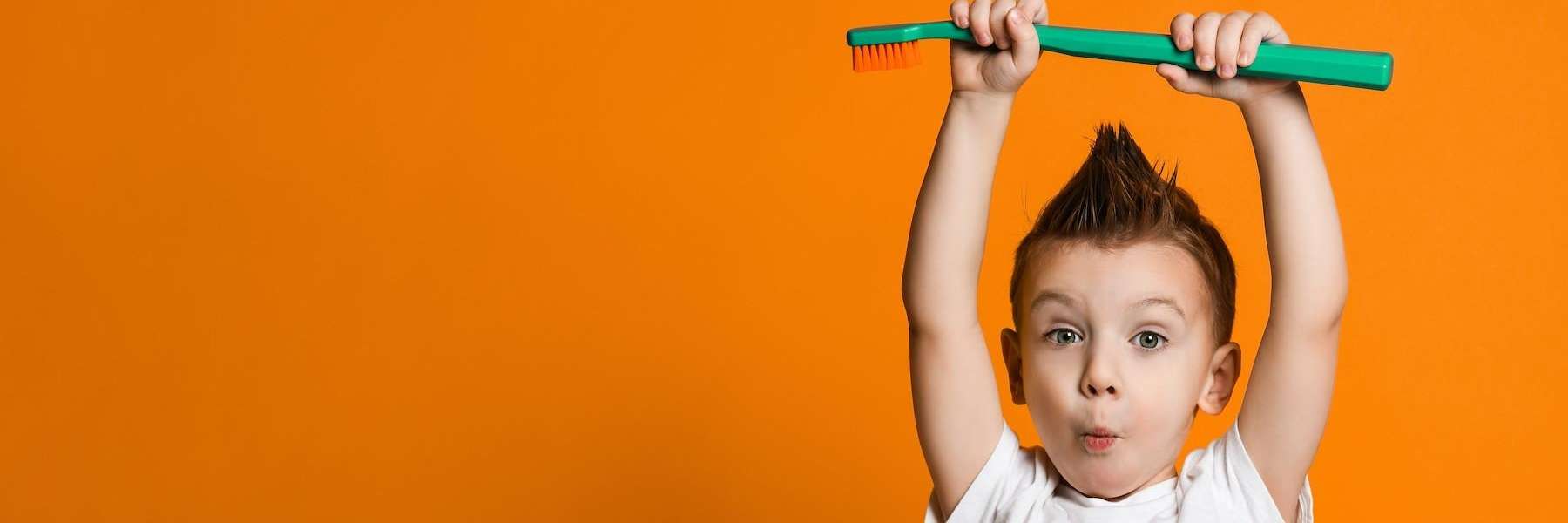 boy with mohawk making face | pediatric dentist apple valley mn
