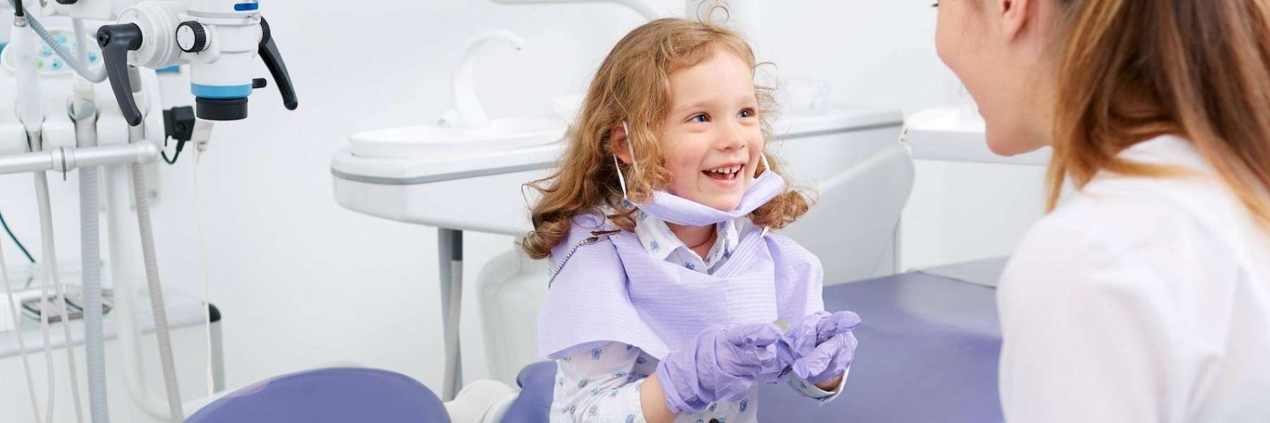 little girl smiling at dentist | dentist apple valley mn