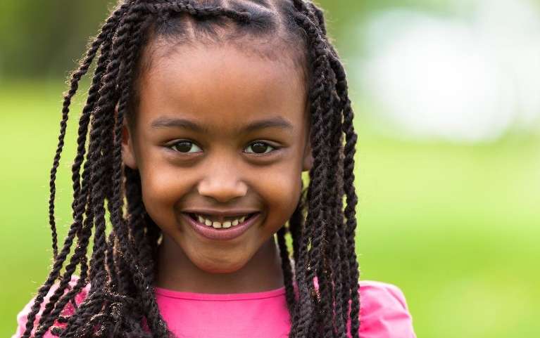 young girl in pink shirt smiling | children's dentist apple valley mn