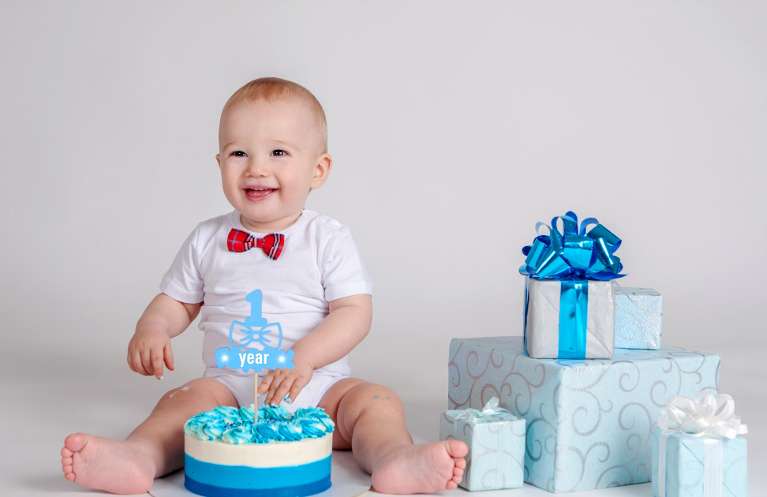 baby smiling with presents | pediatric dentist near me