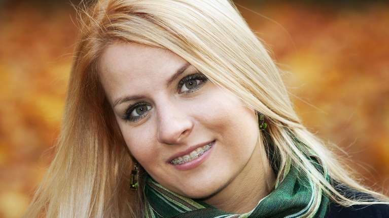 blonde woman smiling | dentist for special needs child