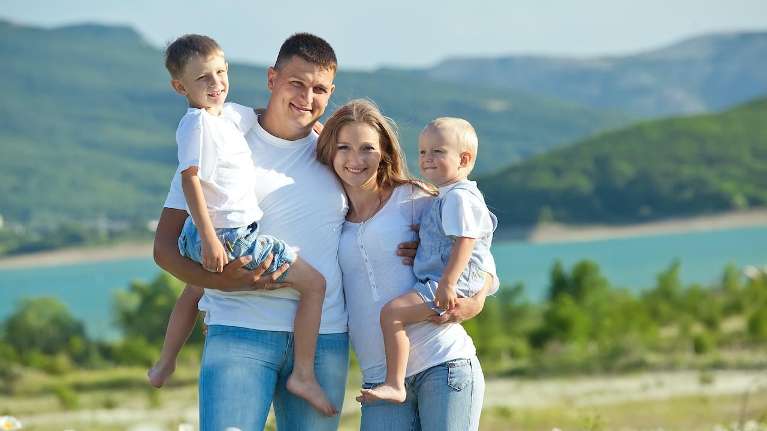 family of four hugging outside | preventive dental care apple valley