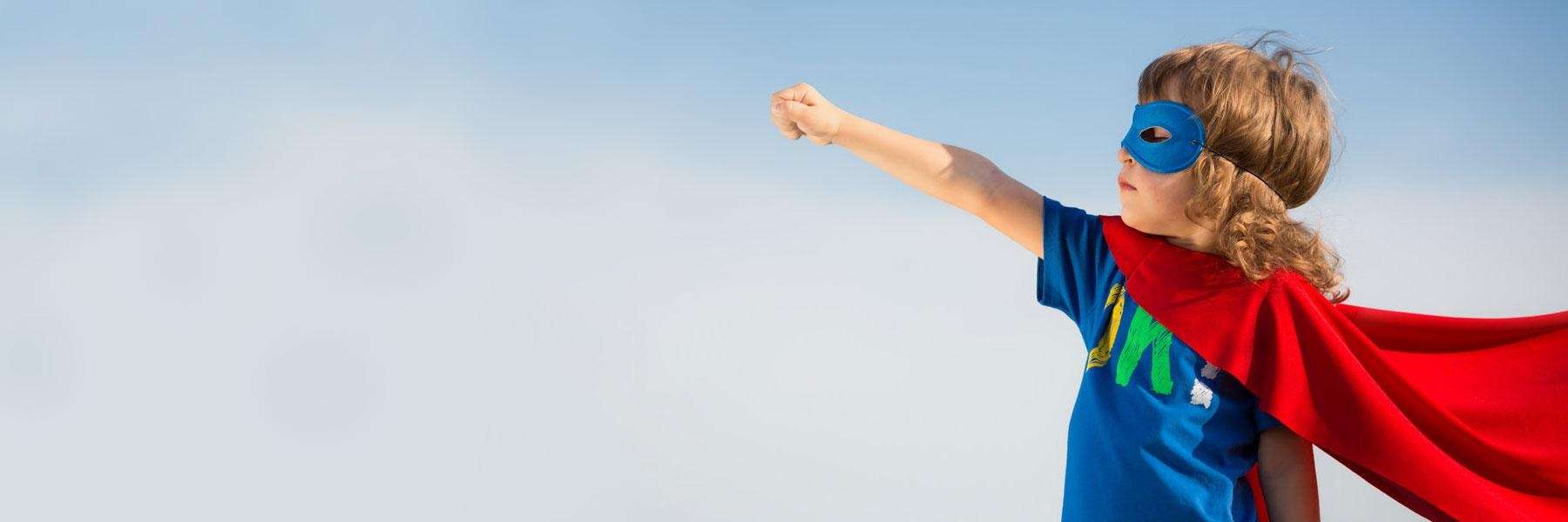 boy with superhero cape | apple valley pediatric dentist