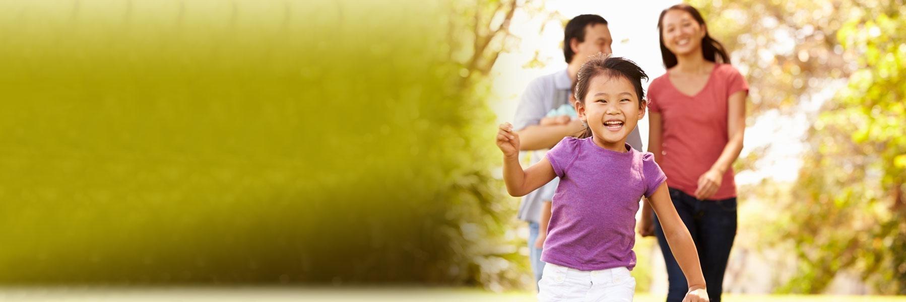 young family running outside l dentist apple valley mn