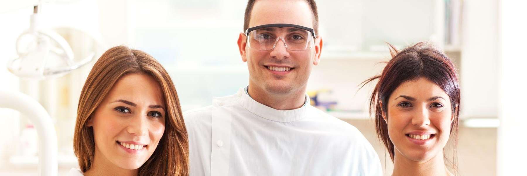 dentist standing with dental staff | pediatric dentist apple valley mn