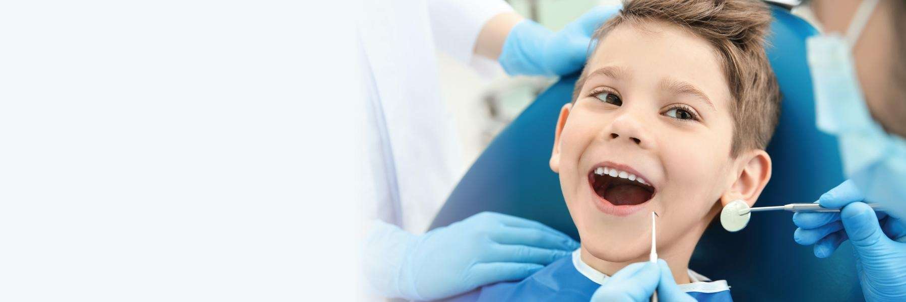 boy receiving dental exam | children's dental exam