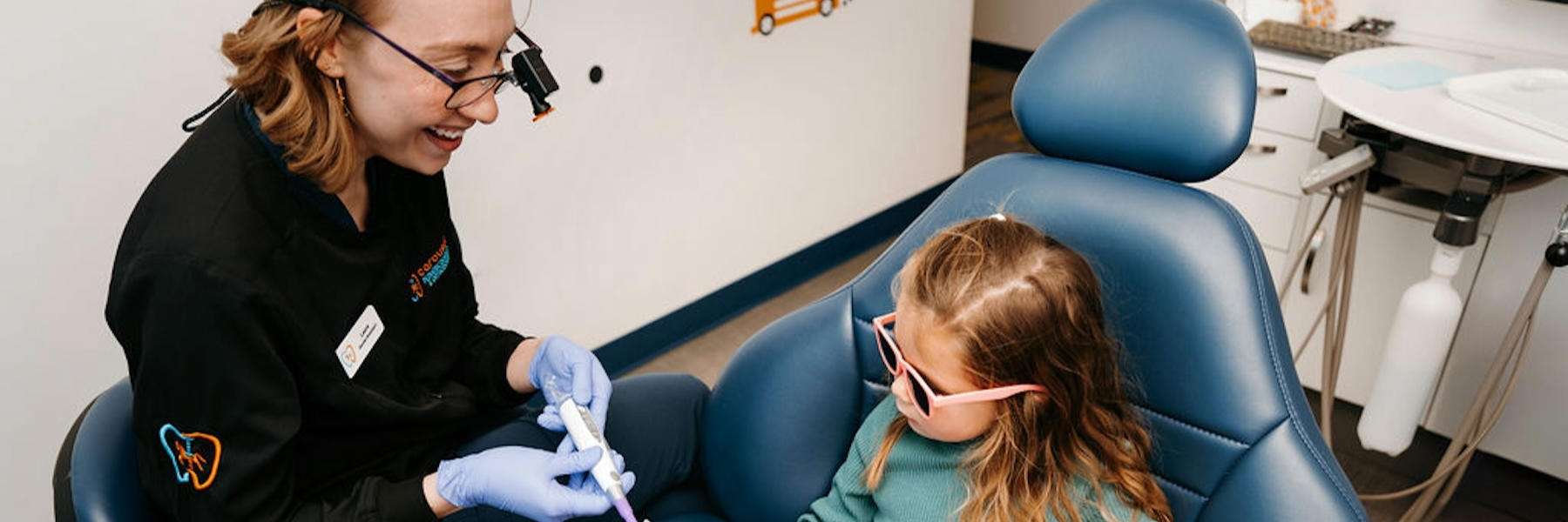 young girl smiling outside | dentist apple valley mn
